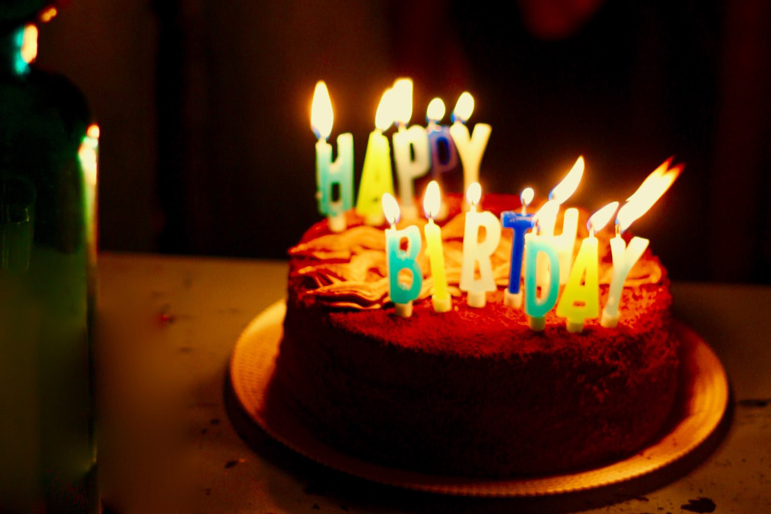 A birthday cake with lighted candles